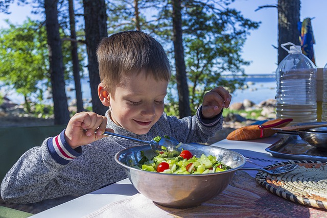 Kid enjoying salad